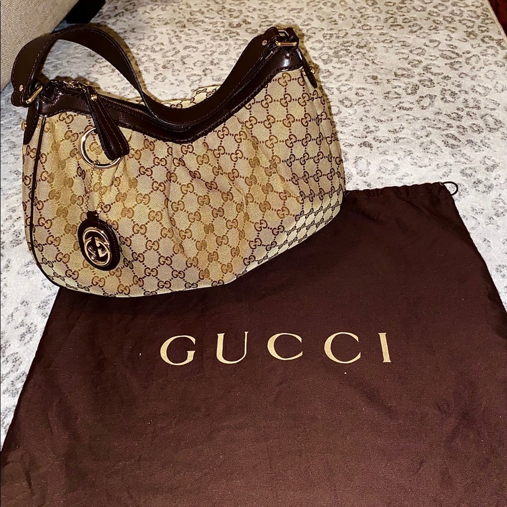 Authentic vintage Gucci shoulder bag. Small wear mark on side of bag.